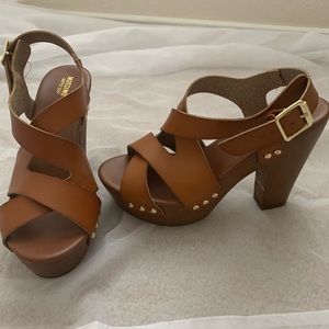 Brown and gold leather like material clog heels